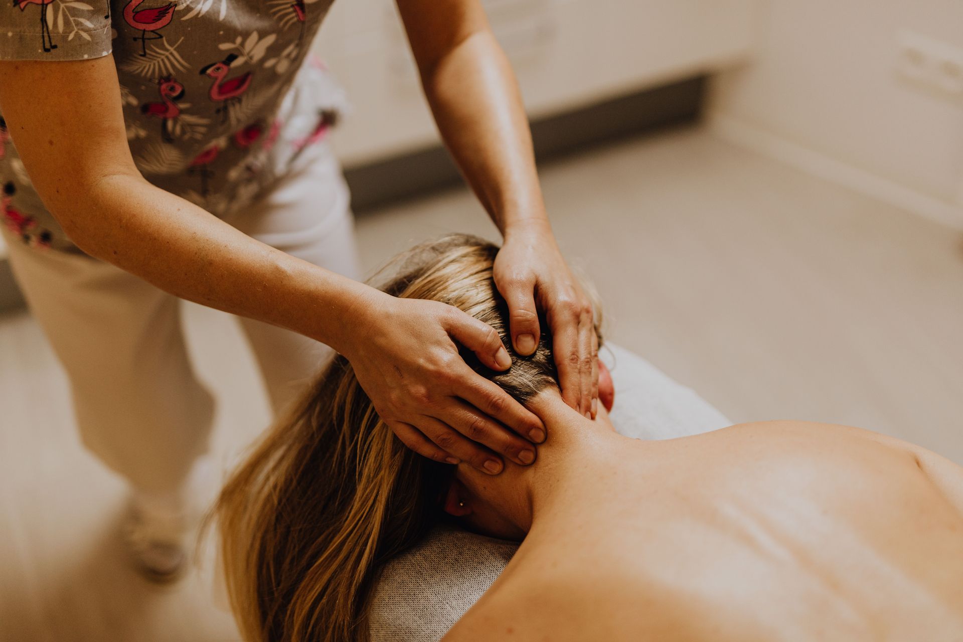 A soothing neck massage focused on relaxation and wellbeing in a therapy setting.